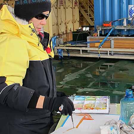 An experience I painted many times, was when the ship was almost surrounded by ice. We dressed in our bulky but very warm Antarctic clothes and walked through the galley and a storage room to a magical sight I will never forget, on the brilliant white sea ice.